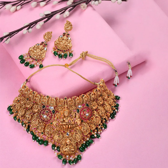 https://fazhionshore.com/products/gold-plated-kemp-stone-studded-lakshmi-design-with-dangling-green-beads-choker-set